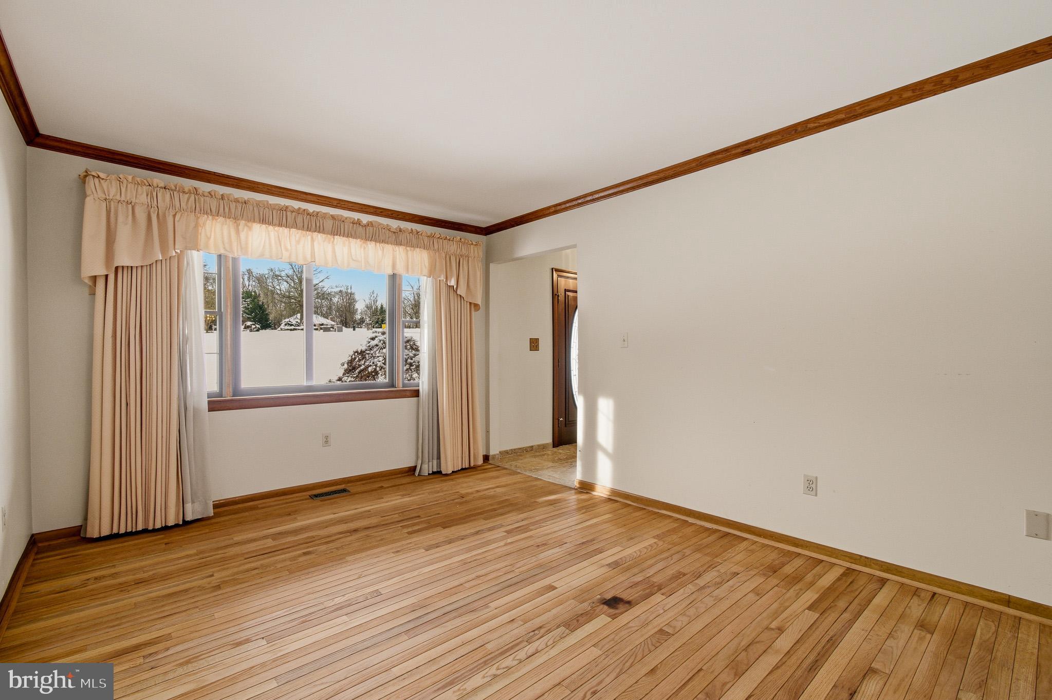 1290 Whirl A Way Court Gambrills, MD 21054 - Photo 21 of 111 a view of an empty room with wooden floor and a window
