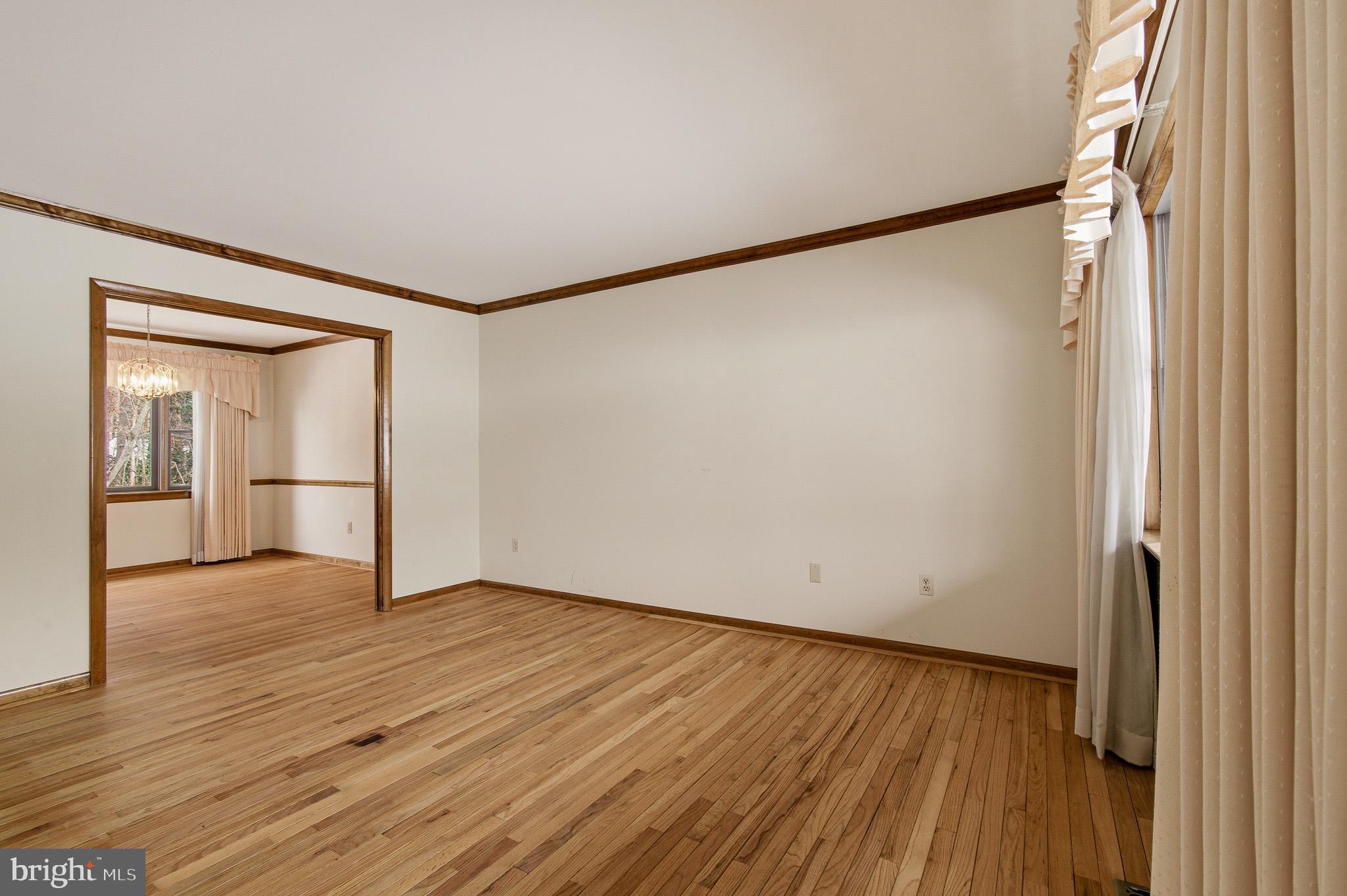 1290 Whirl A Way Court Gambrills, MD 21054 - Photo 22 of 111 a view of an empty room with wooden floor and a window