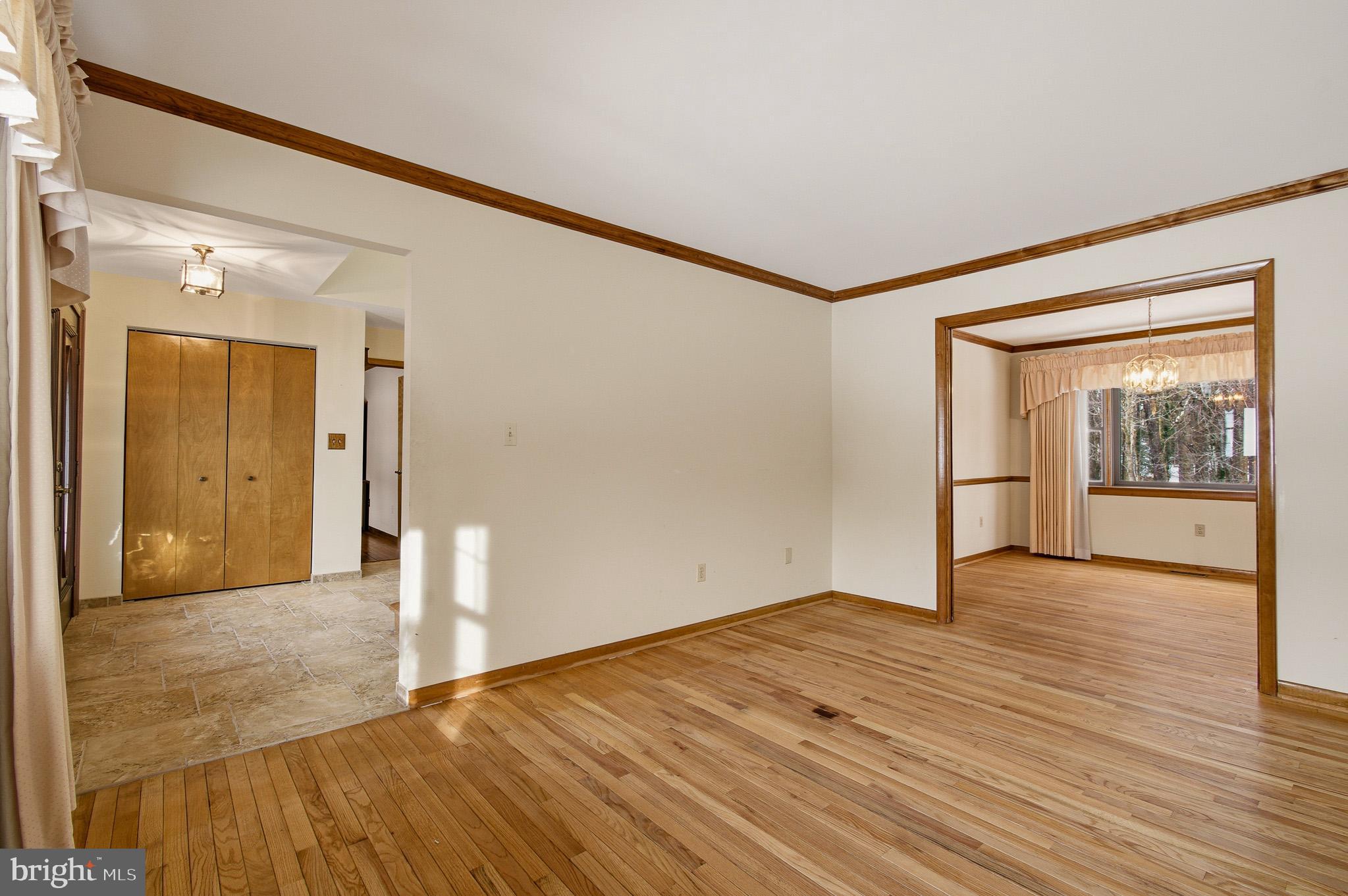1290 Whirl A Way Court Gambrills, MD 21054 - Photo 23 of 111 a view of an empty room with wooden floor and a window