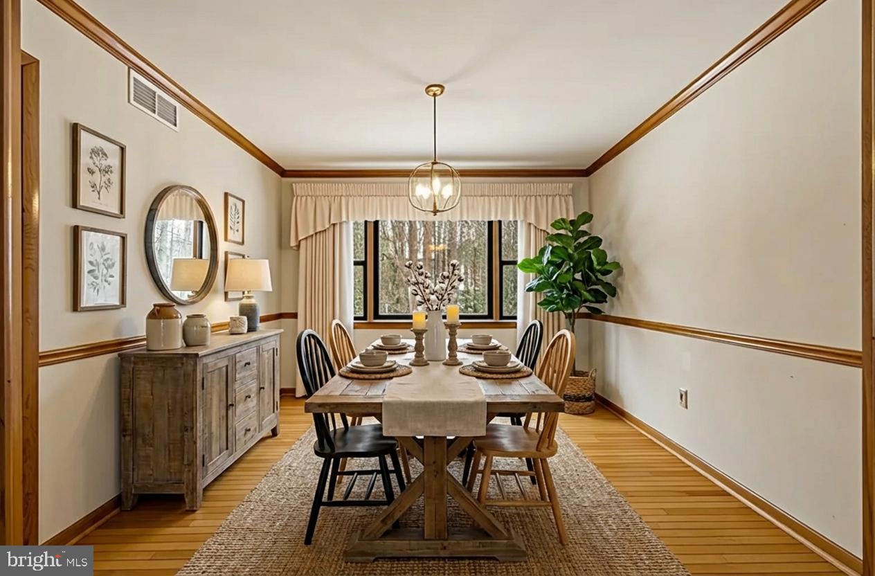 1290 Whirl A Way Court Gambrills, MD 21054 - Photo 24 of 111 a view of a dining room with furniture window and wooden floor