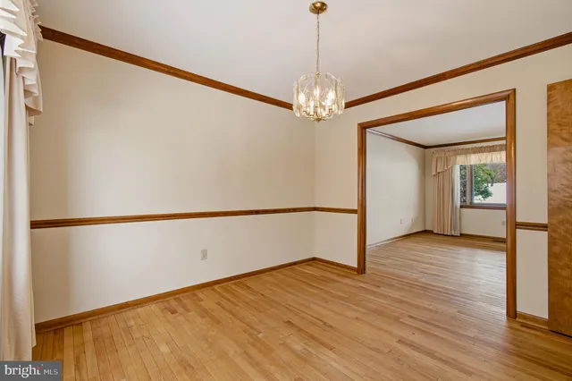 a view of a livingroom with furniture and a window