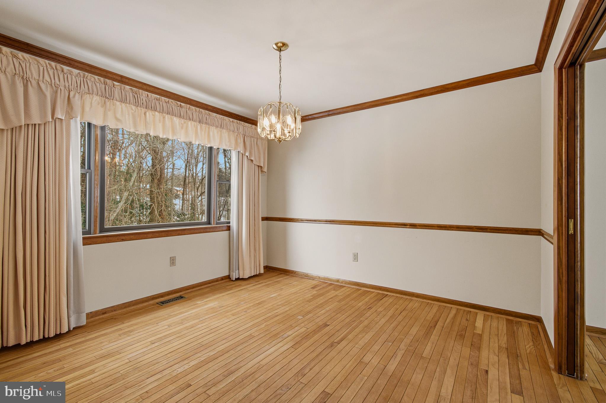 1290 Whirl A Way Court Gambrills, MD 21054 - Photo 31 of 111 a view of an empty room with wooden floor and a window