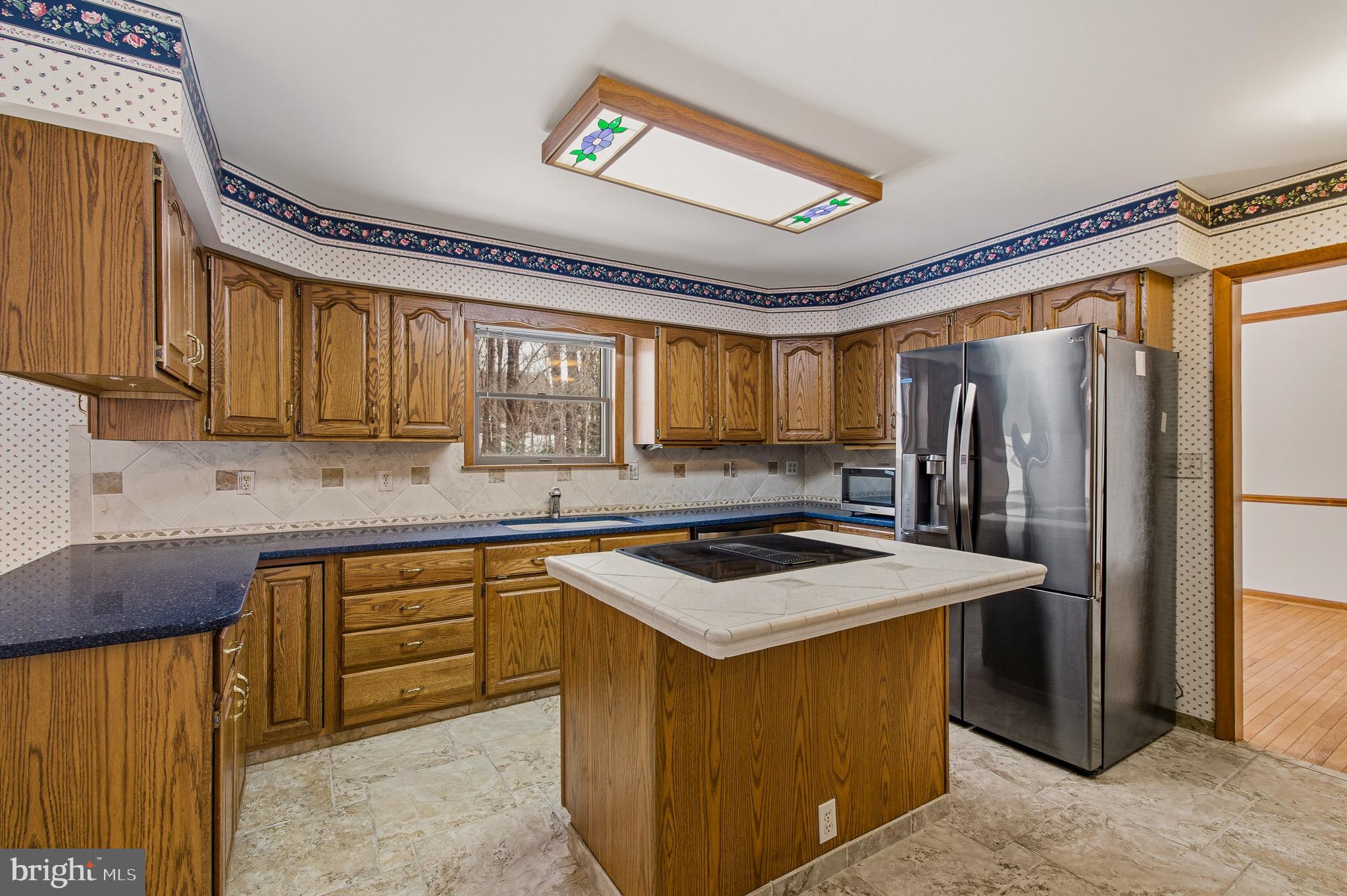 1290 Whirl A Way Court Gambrills, MD 21054 - Photo 36 of 111 a kitchen with stainless steel appliances granite countertop a sink stove and refrigerator