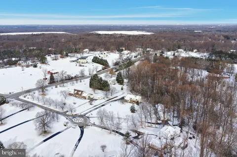 a living room with furniture a rug and a window
