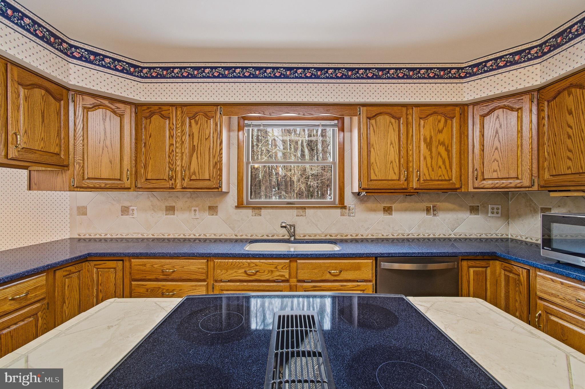 1290 Whirl A Way Court Gambrills, MD 21054 - Photo 43 of 111 a kitchen with a sink cabinets and window