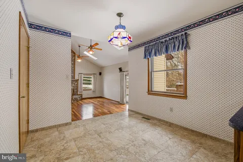 a view of balcony with wooden floor and outdoor seating