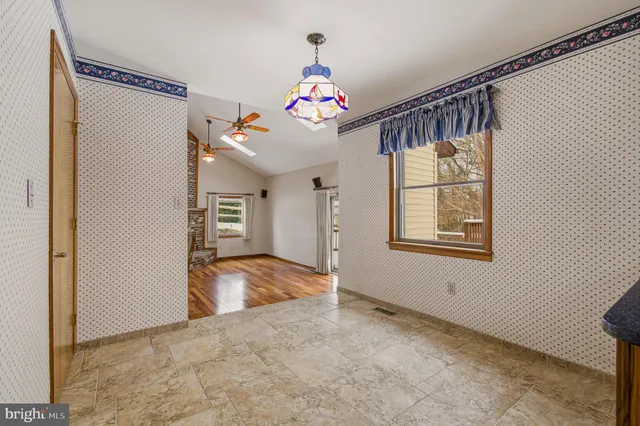 a view of balcony with wooden floor and outdoor seating