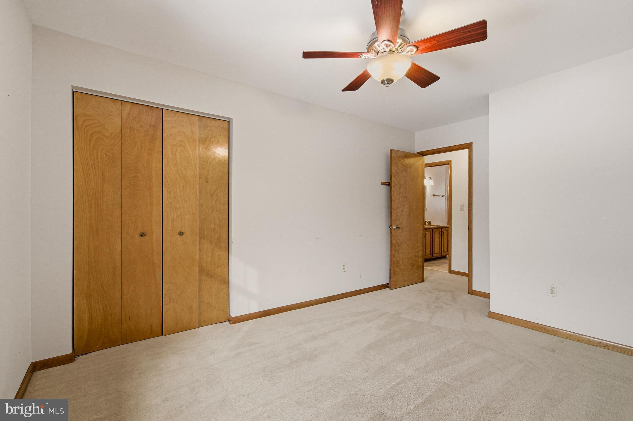 1290 Whirl A Way Court Gambrills, MD 21054 - Photo 79 of 111 an empty room with closet and a chandelier fan