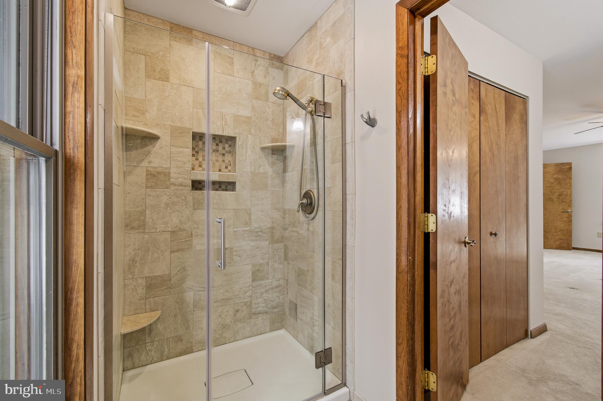 1290 Whirl A Way Court Gambrills, MD 21054 - Photo 85 of 111 a bathroom with a shower and a glass door