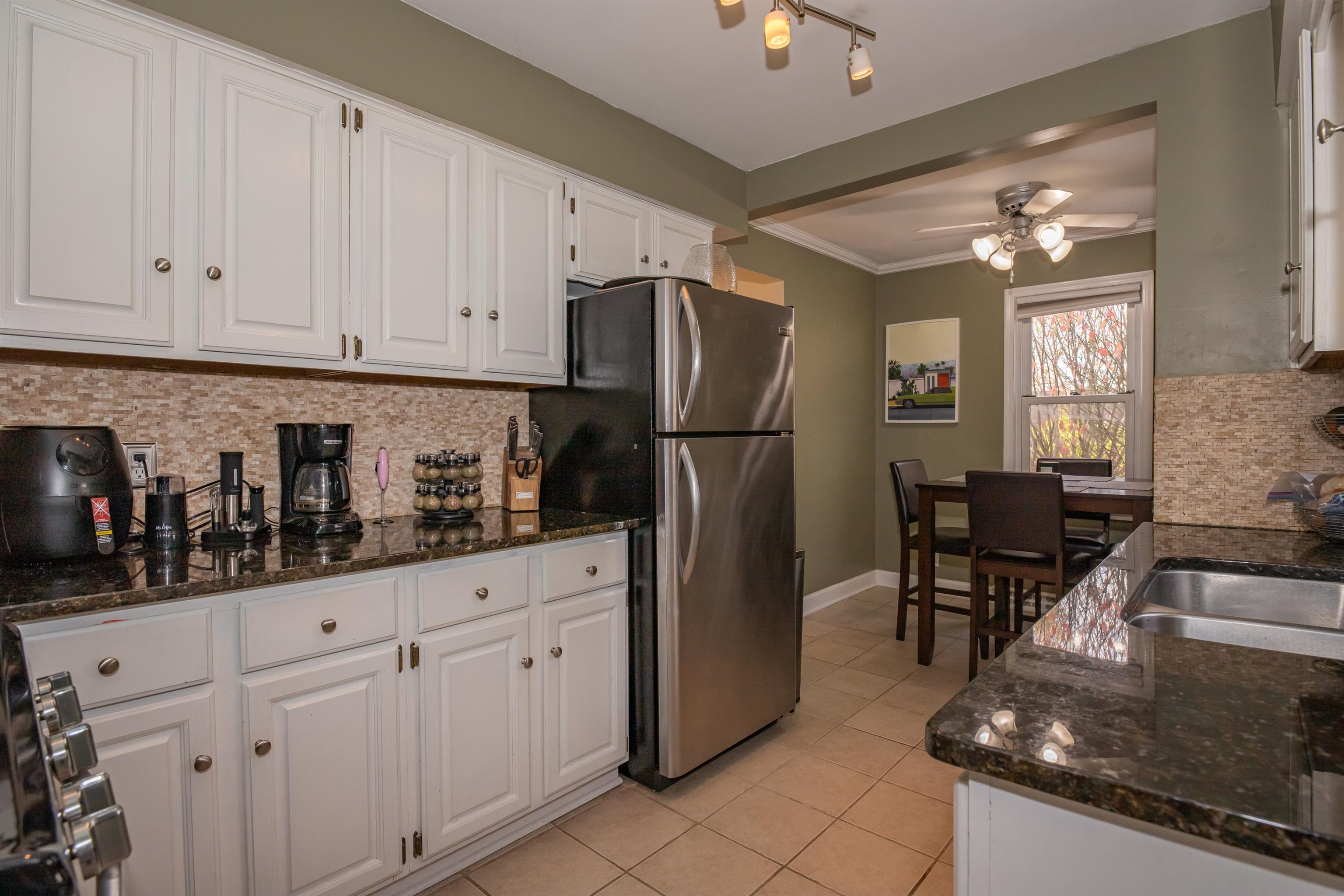 3808 Highcrest Road Rockford, IL 61107 - Photo 11 of 34 a kitchen with white cabinets and refrigerator