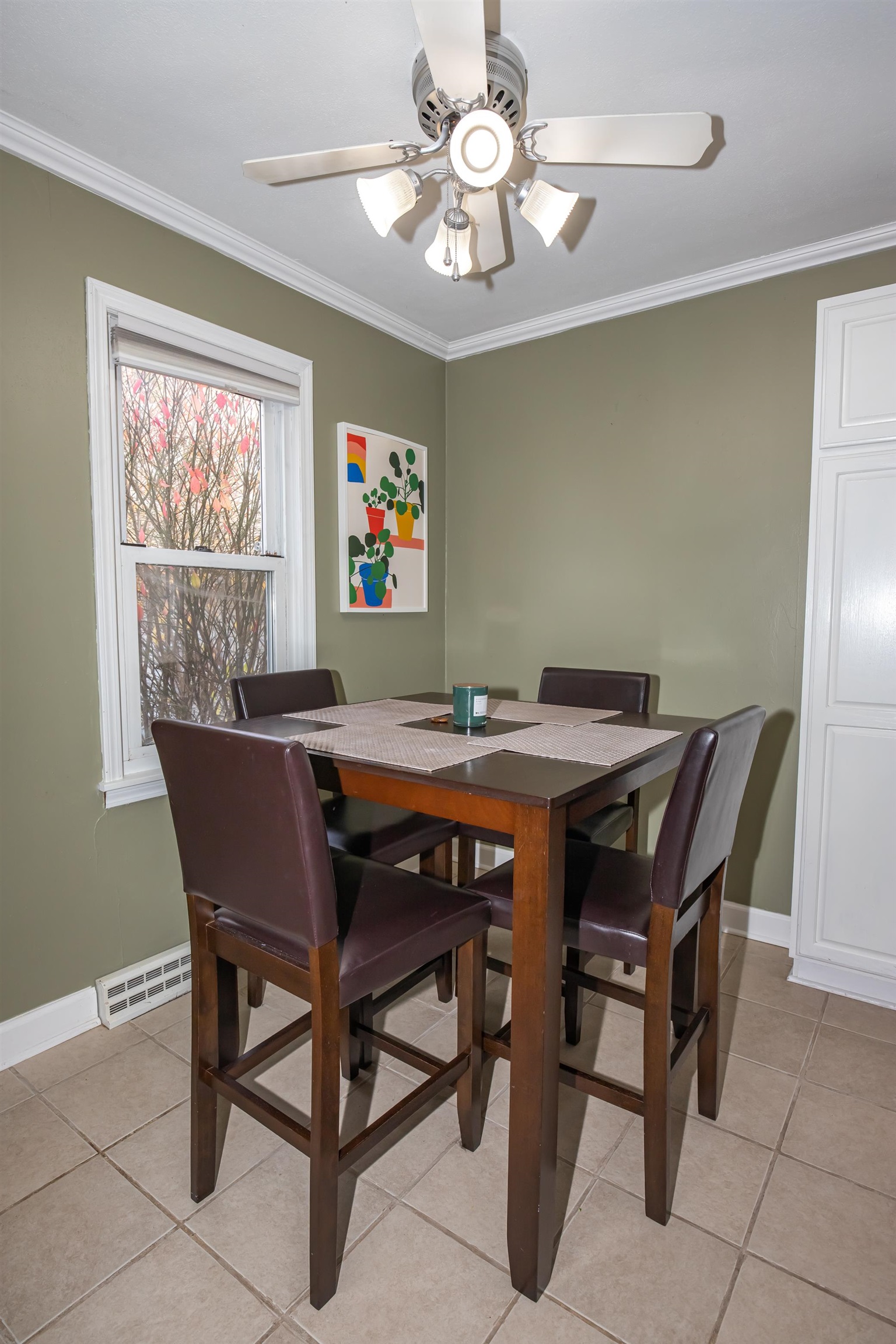 3808 Highcrest Road Rockford, IL 61107 - Photo 13 of 34 a dining room with furniture a rug and a chandelier