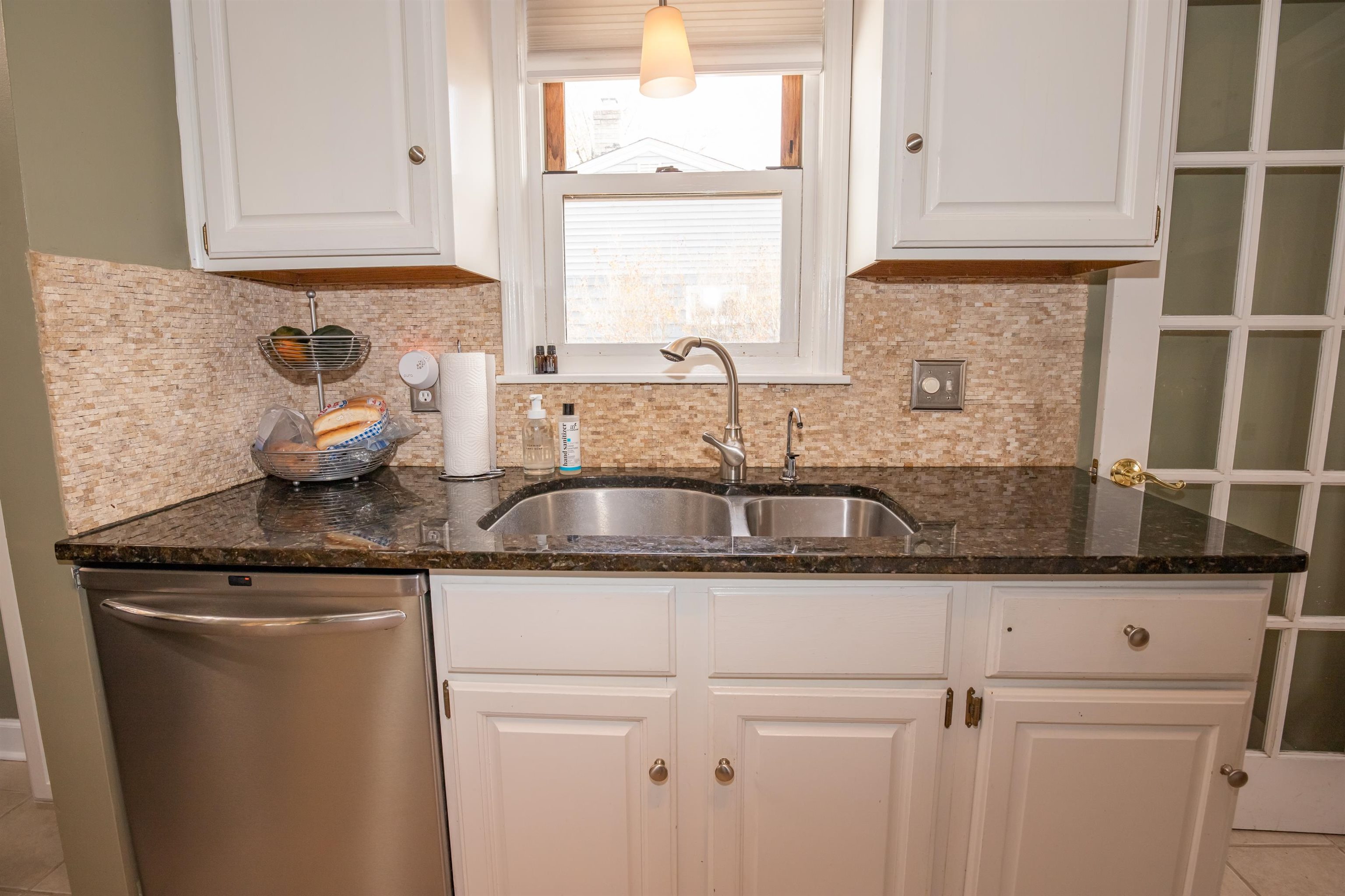 3808 Highcrest Road Rockford, IL 61107 - Photo 14 of 34 a kitchen with granite countertop a sink window and cabinets