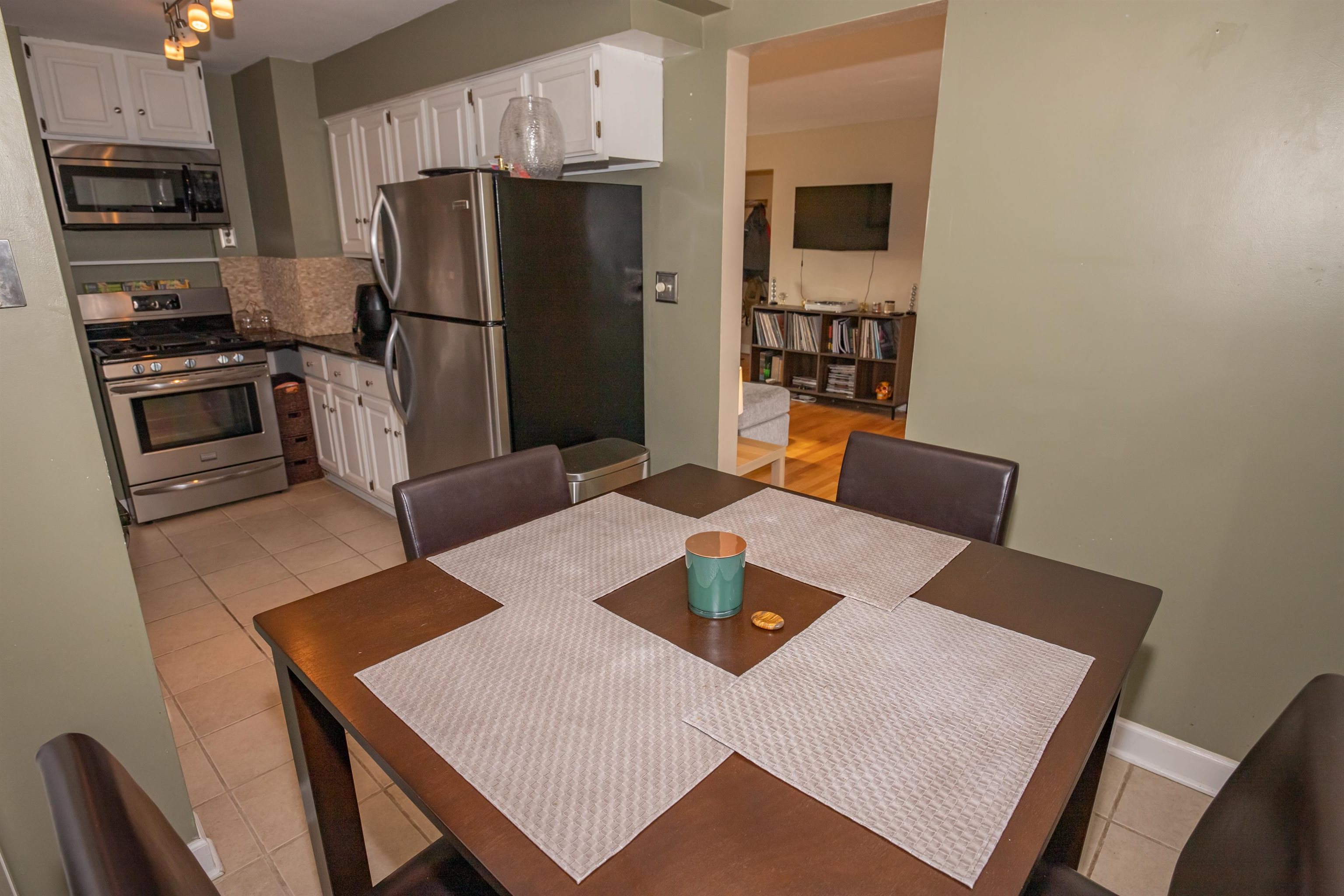 3808 Highcrest Road Rockford, IL 61107 - Photo 15 of 34 a kitchen with a table chairs and refrigerator