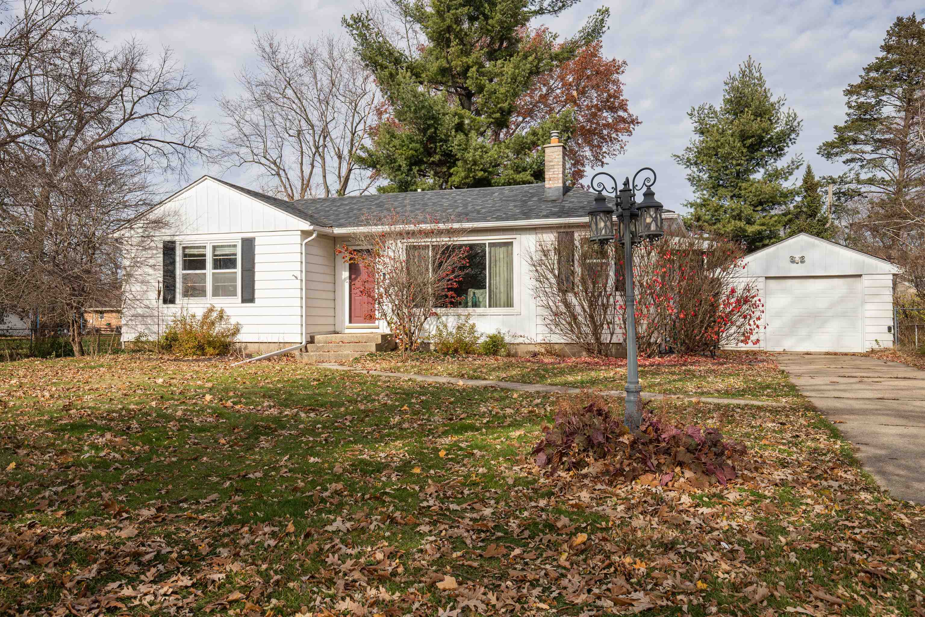 3808 Highcrest Road Rockford, IL 61107 - Photo 2 of 34 a house that has a tree in front of it