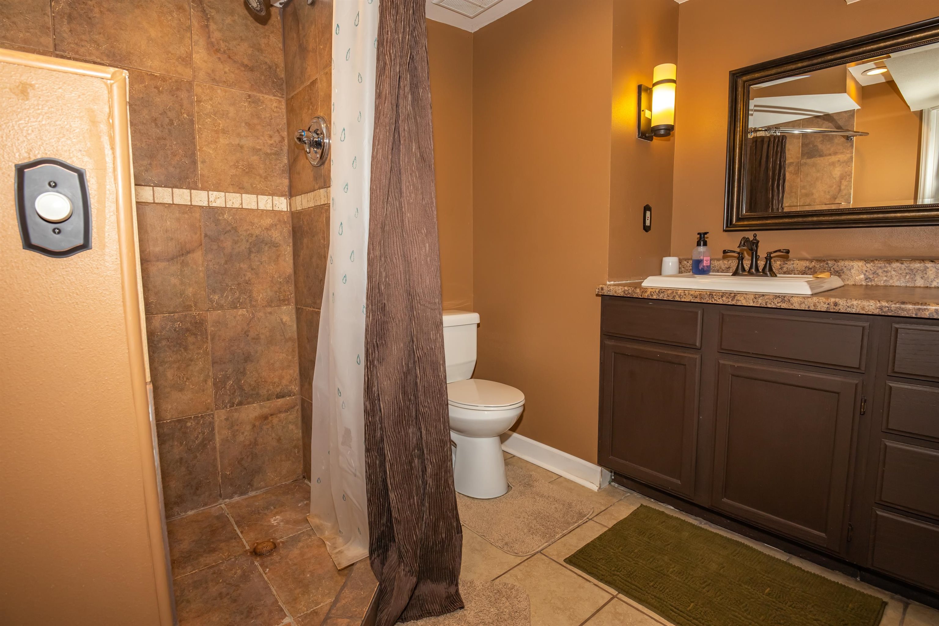 3808 Highcrest Road Rockford, IL 61107 - Photo 30 of 34 a bathroom with a granite countertop sink toilet and shower