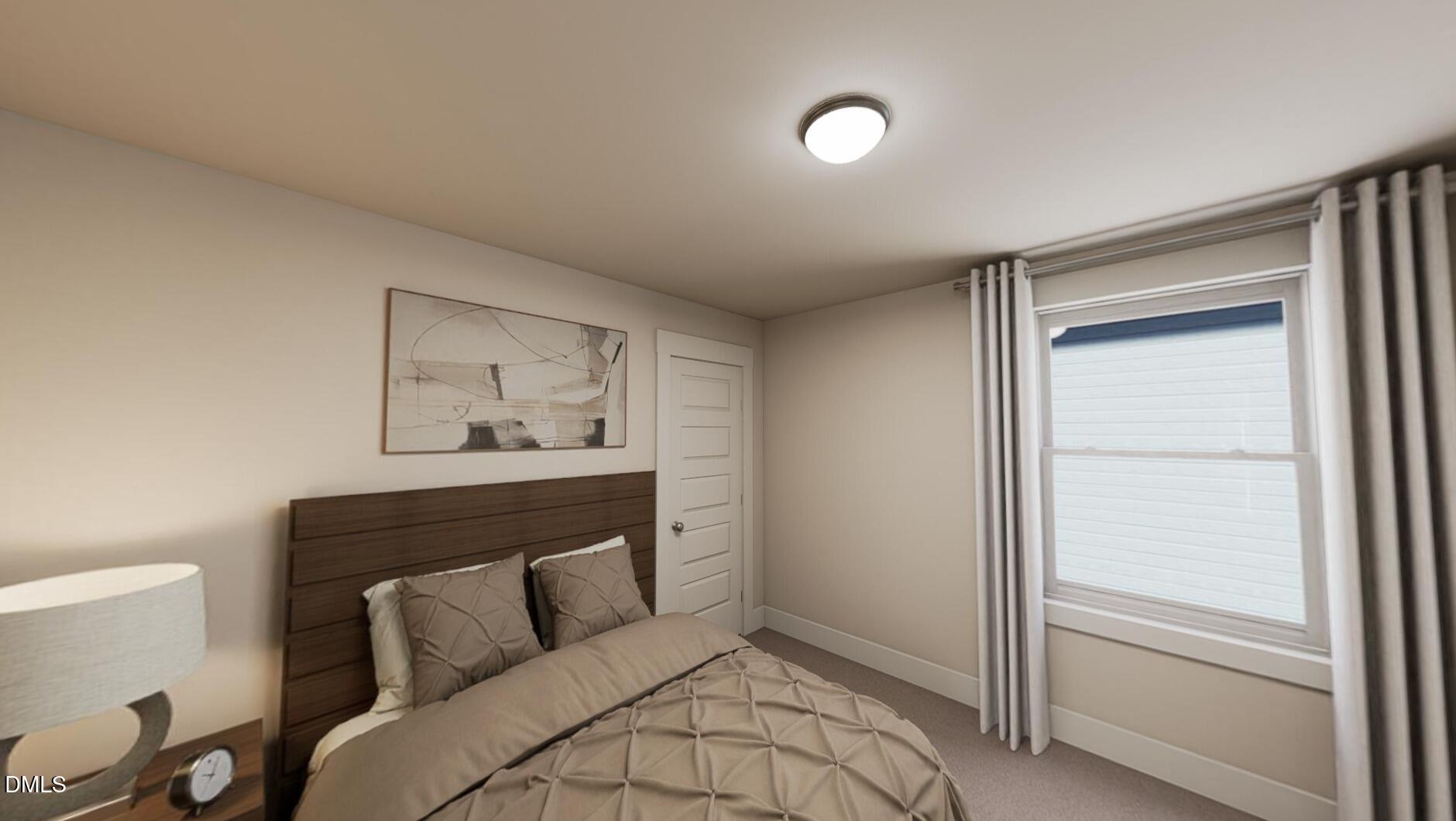 833 Central Park Drive Raleigh, NC 27604 - Photo 11 of 20 a bedroom with a bed and a window