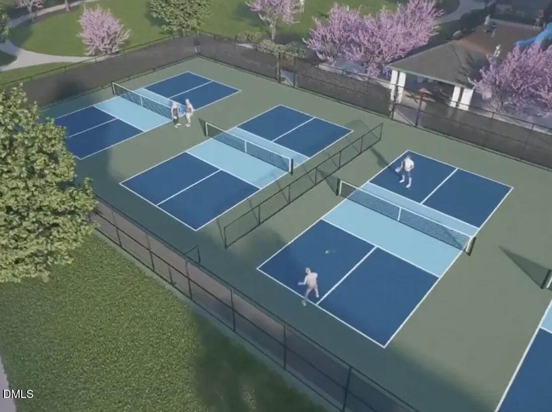 833 Central Park Drive Raleigh, NC 27604 - Photo 17 of 20 an aerial view of a tennis ground with large trees