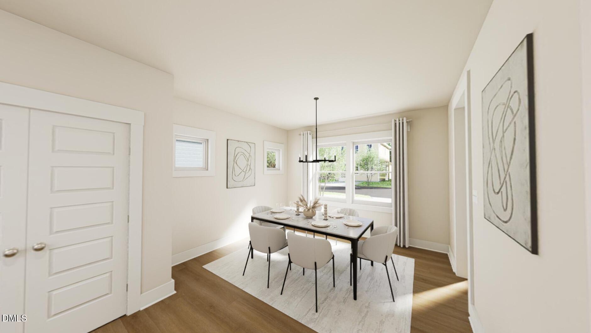833 Central Park Drive Raleigh, NC 27604 - Photo 6 of 20 a view of a dining room with furniture and wooden floor