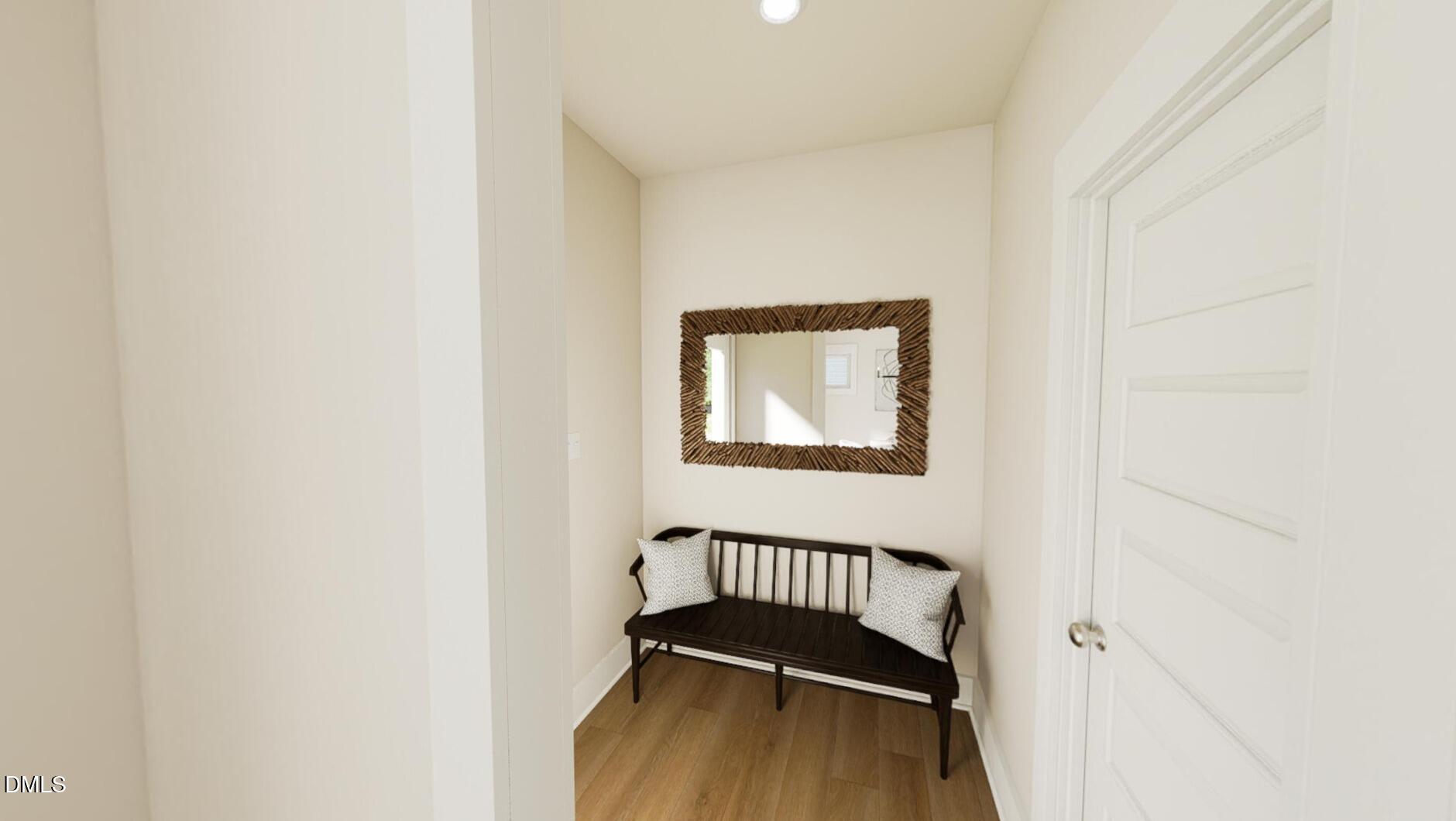 833 Central Park Drive Raleigh, NC 27604 - Photo 7 of 20 a view of a hallway with wooden floor and a dining table