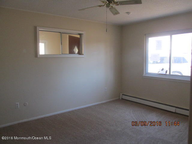 6 D Walnut Road Manahawkin, NJ 08050 - Photo 6 of 7 an empty room with a window