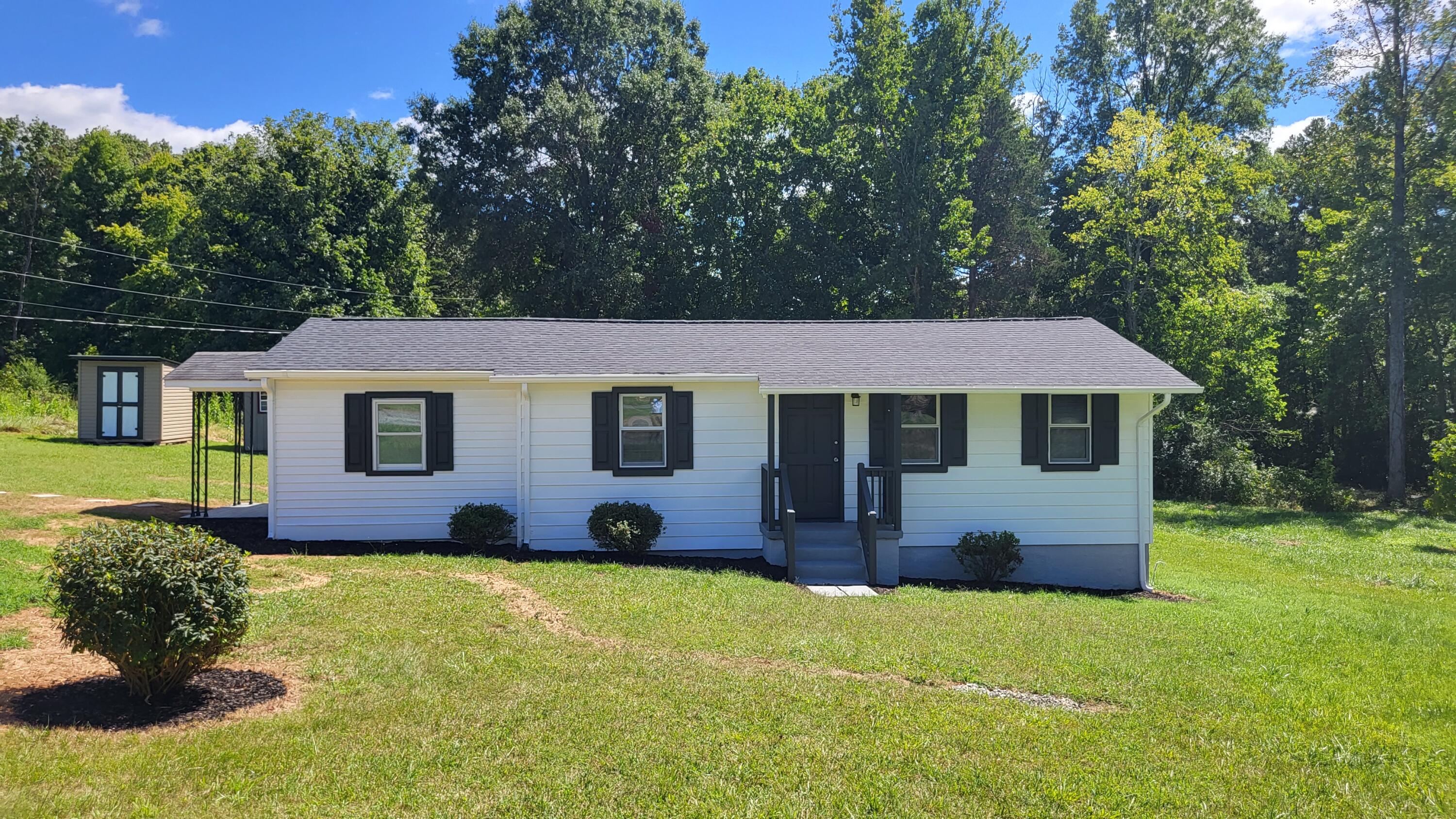 7588 Venable Road Kents Store, VA 23084 - Photo 1 of 38 a front view of a house with garden
