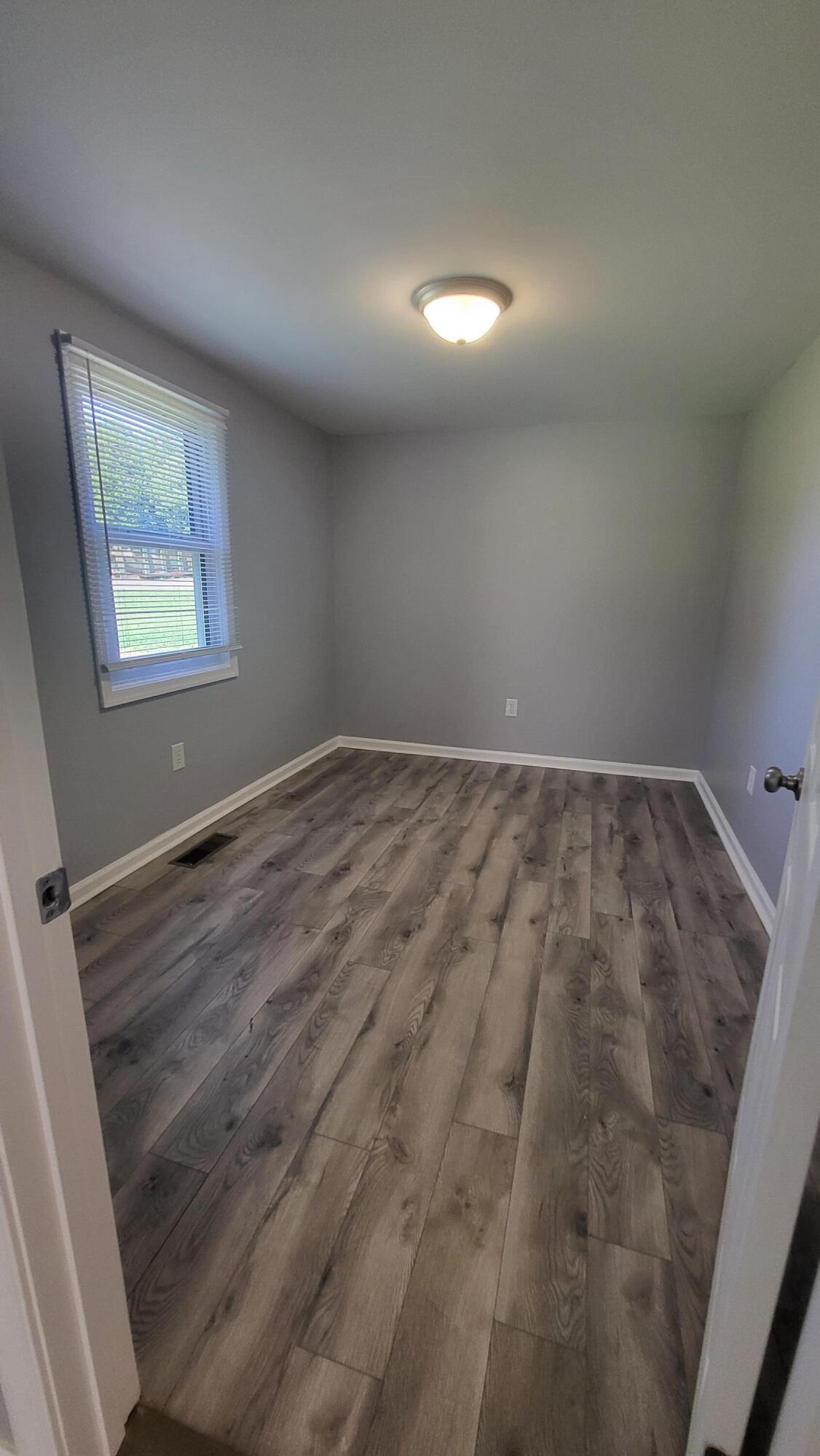 7588 Venable Road Kents Store, VA 23084 - Photo 16 of 38 an empty room with windows