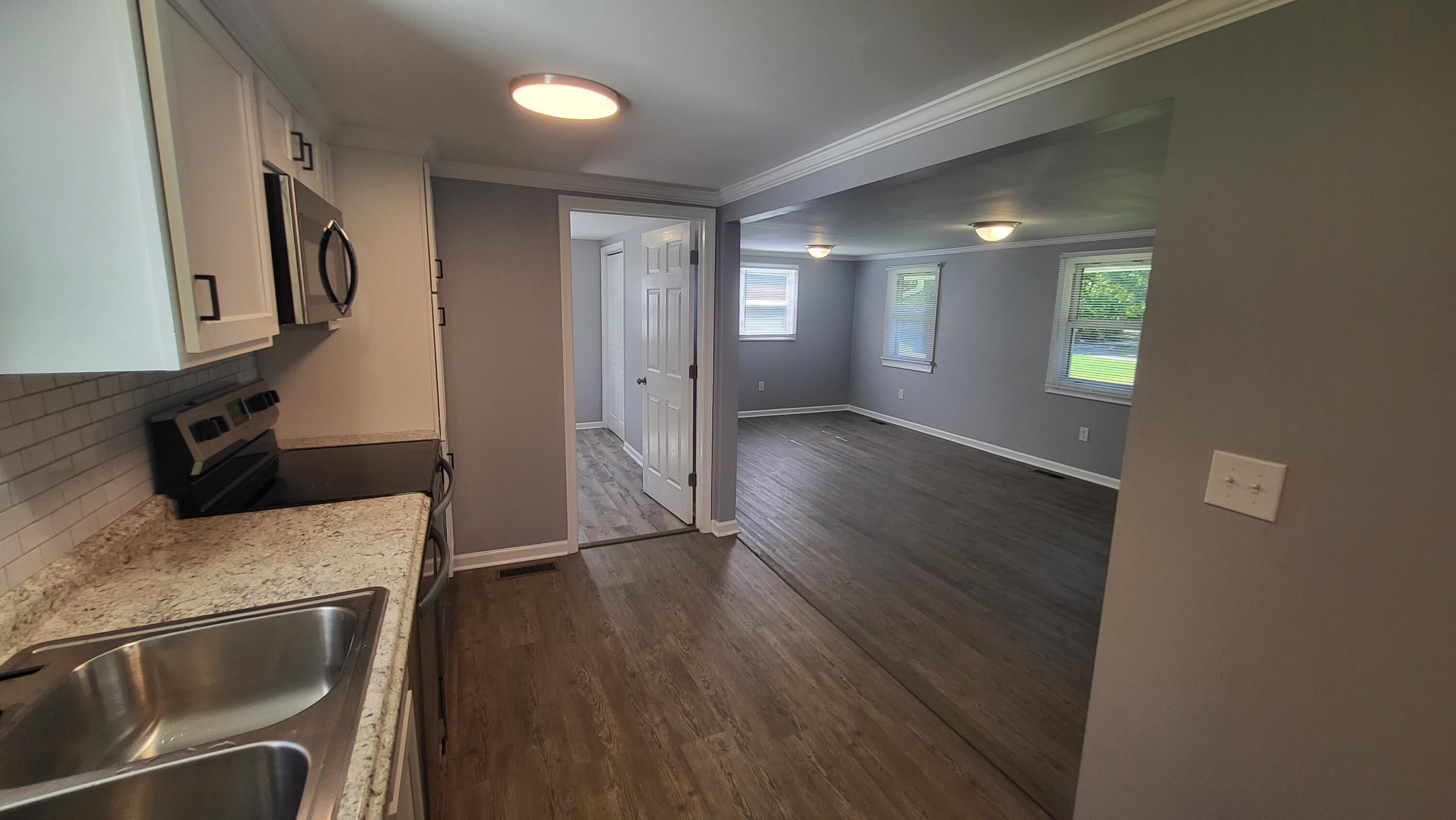 7588 Venable Road Kents Store, VA 23084 - Photo 22 of 38 a view of a kitchen cabinets and wooden floor