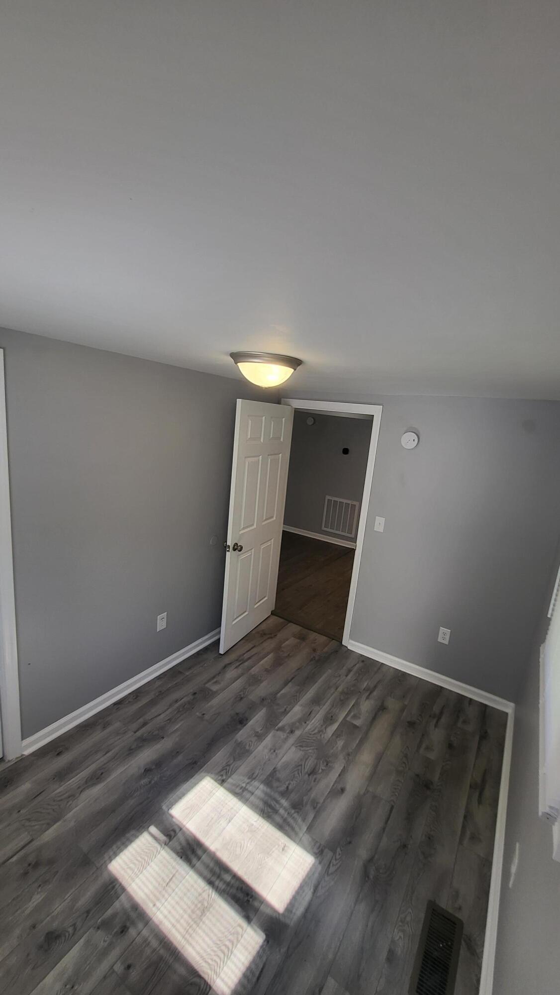 7588 Venable Road Kents Store, VA 23084 - Photo 24 of 38 a view of a hallway with wooden floor