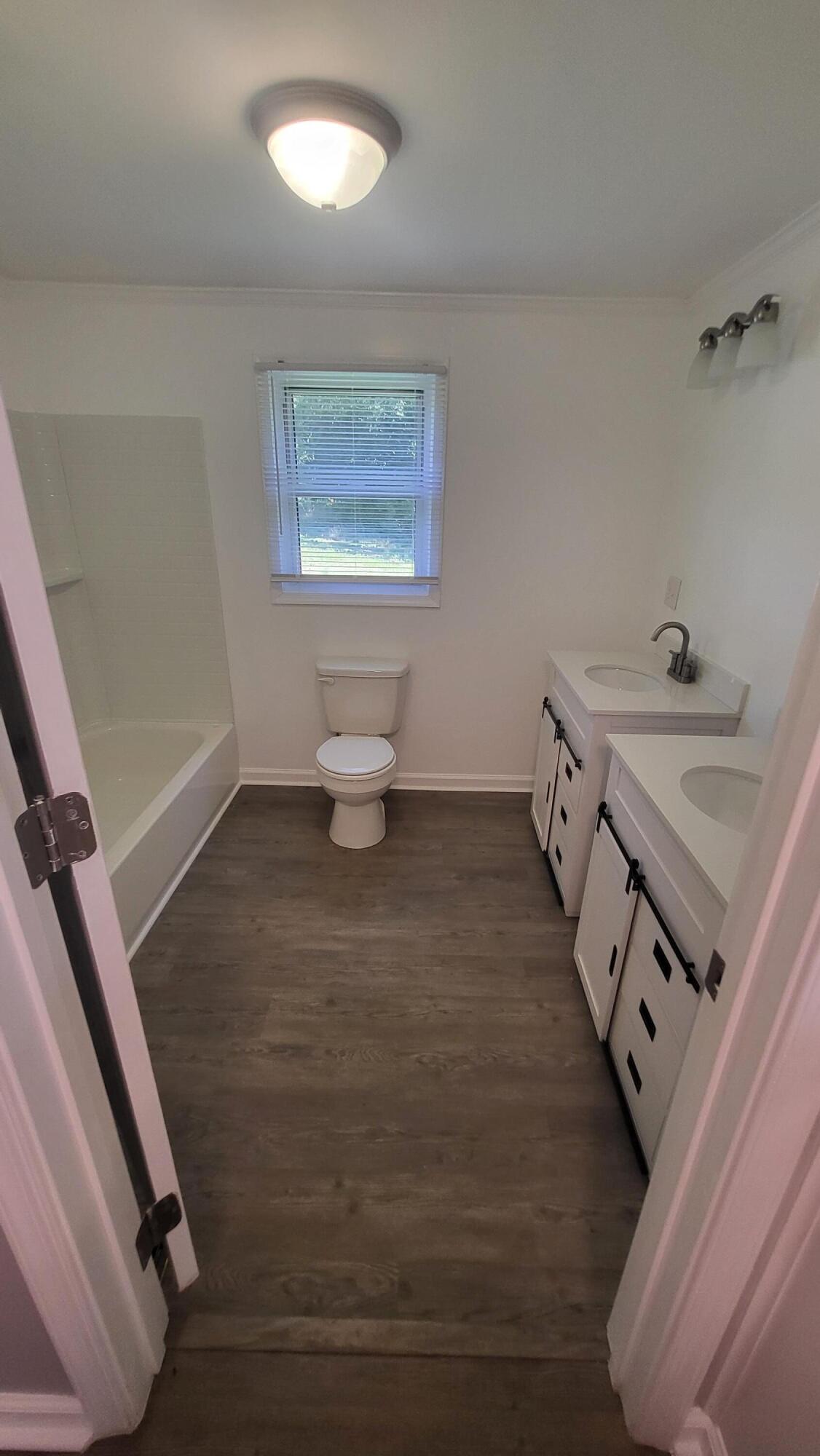 7588 Venable Road Kents Store, VA 23084 - Photo 29 of 38 a bathroom with a sink toilet and a mirror