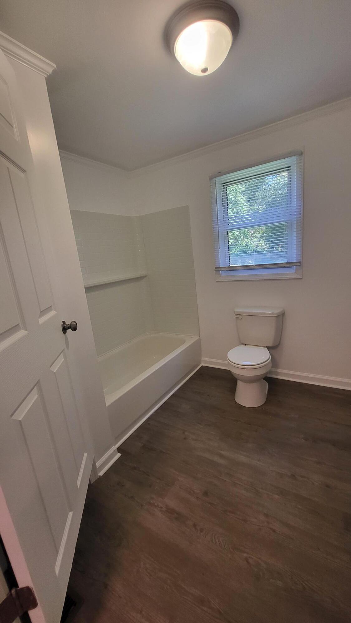 7588 Venable Road Kents Store, VA 23084 - Photo 30 of 38 a bathroom with a toilet and a view of bathroom