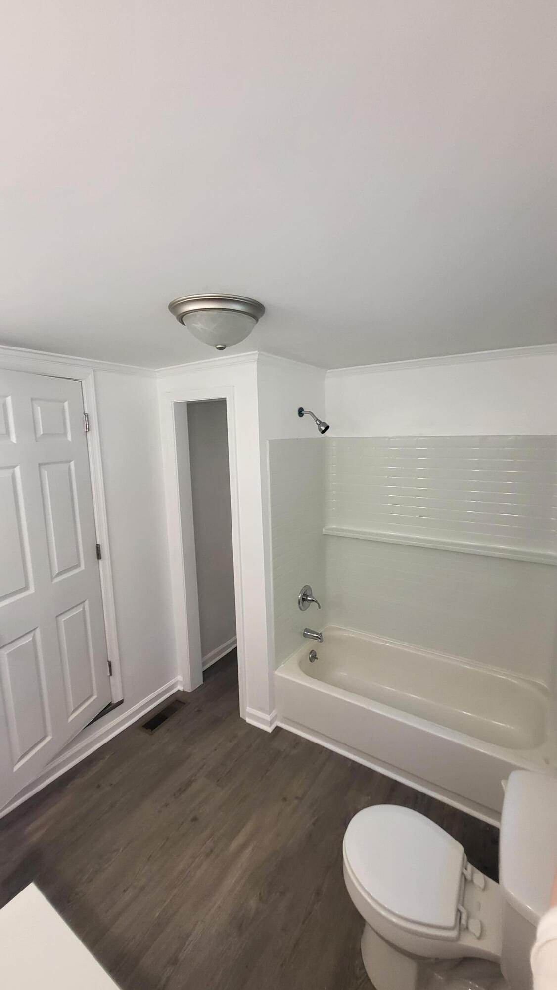 7588 Venable Road Kents Store, VA 23084 - Photo 32 of 38 a bathroom with a toilet and a tub