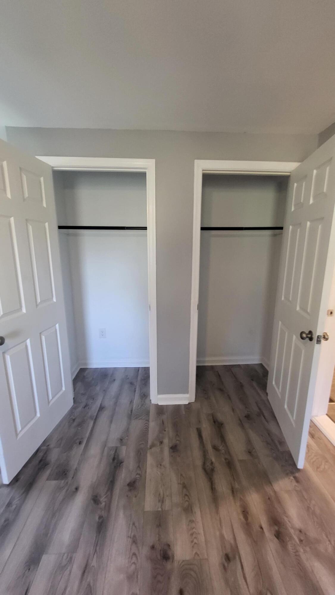 7588 Venable Road Kents Store, VA 23084 - Photo 35 of 38 a view of an empty room with wooden floor and a bathroom