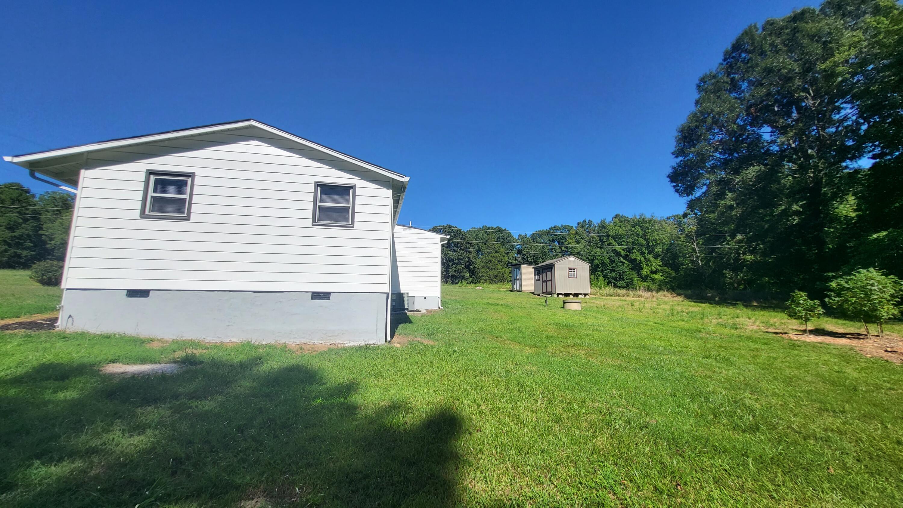 7588 Venable Road Kents Store, VA 23084 - Photo 36 of 38 a front view of a house with a yard and trees