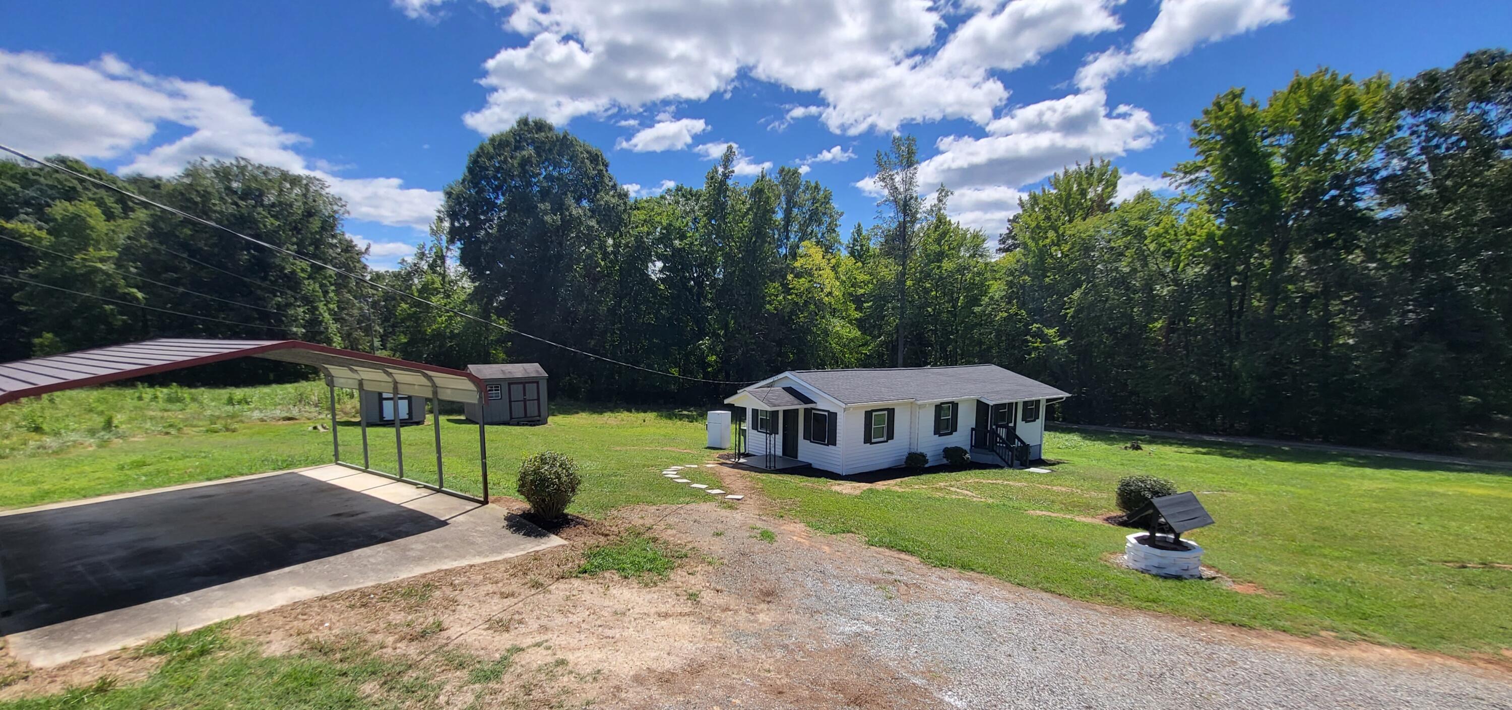 7588 Venable Road Kents Store, VA 23084 - Photo 6 of 38 a house view with a garden space