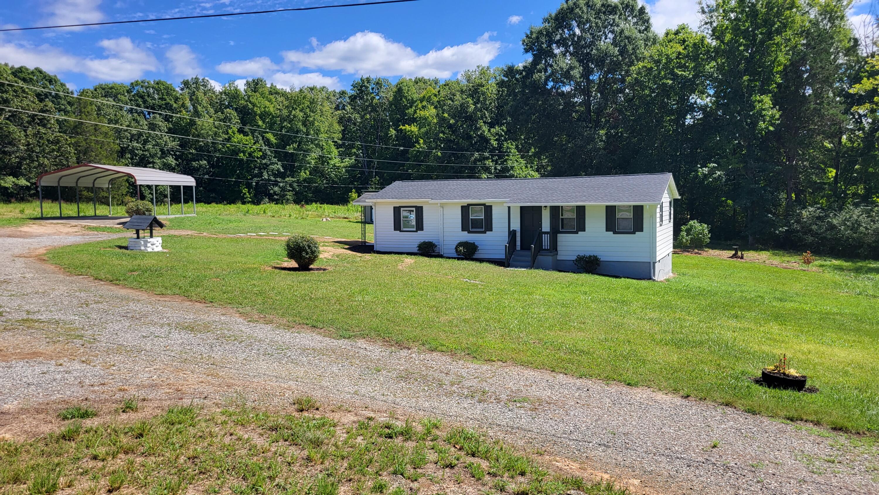 7588 Venable Road Kents Store, VA 23084 - Photo 9 of 38 a view of a house with backyard and a sitting area