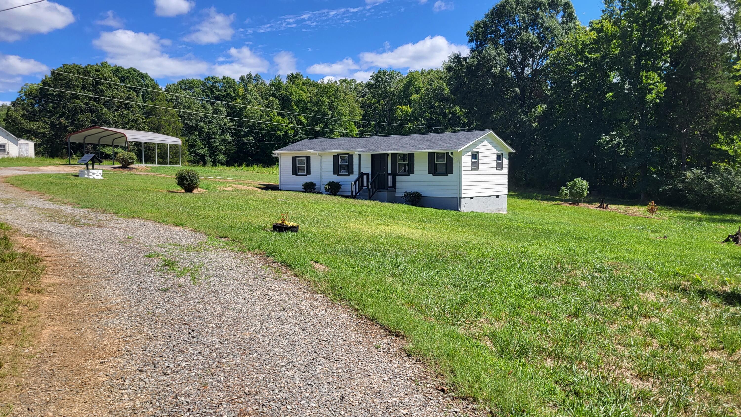 7588 Venable Road Kents Store, VA 23084 - Photo 10 of 38 a front view of a house with garden
