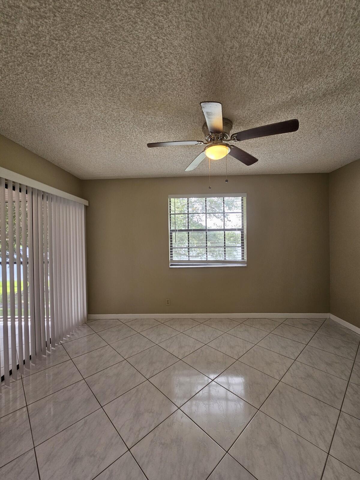 3150 Leewood Terrace, Unit L222 Boca Raton, FL 33431 - Photo 17 of 39 a view of an empty room with a window