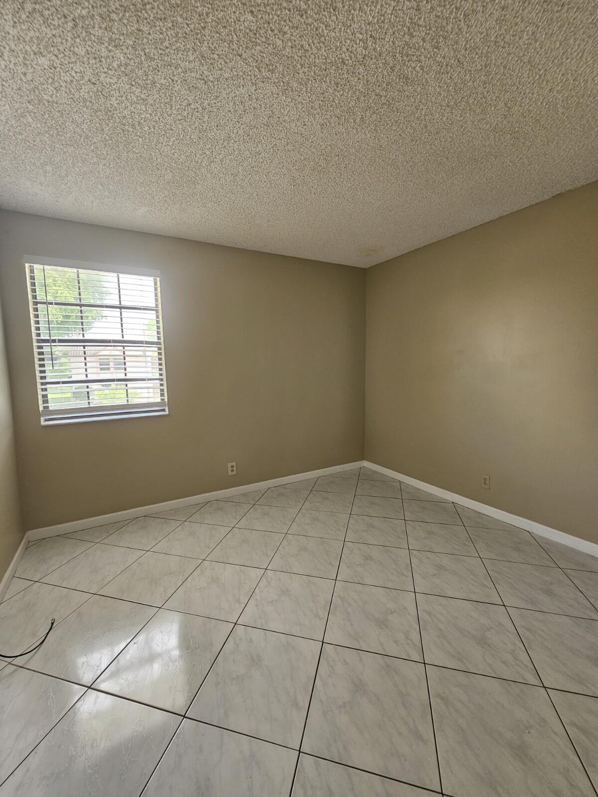 3150 Leewood Terrace, Unit L222 Boca Raton, FL 33431 - Photo 20 of 39 an empty room with windows