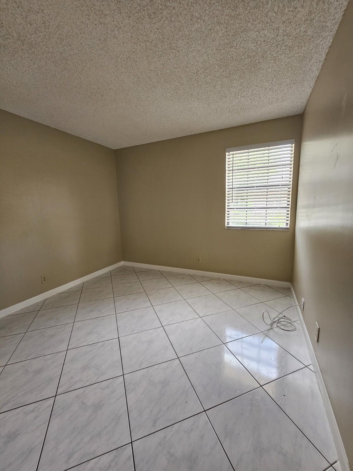 3150 Leewood Terrace, Unit L222 Boca Raton, FL 33431 - Photo 22 of 39 a view of an empty room with a window