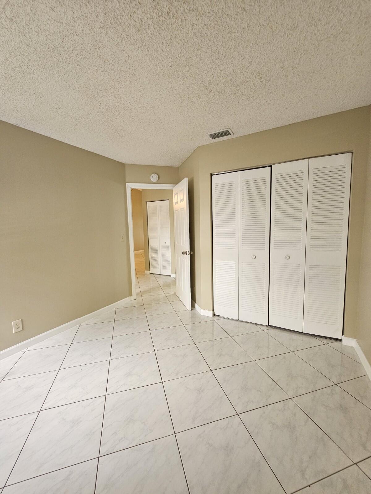 3150 Leewood Terrace, Unit L222 Boca Raton, FL 33431 - Photo 23 of 39 a view of an empty room with a window
