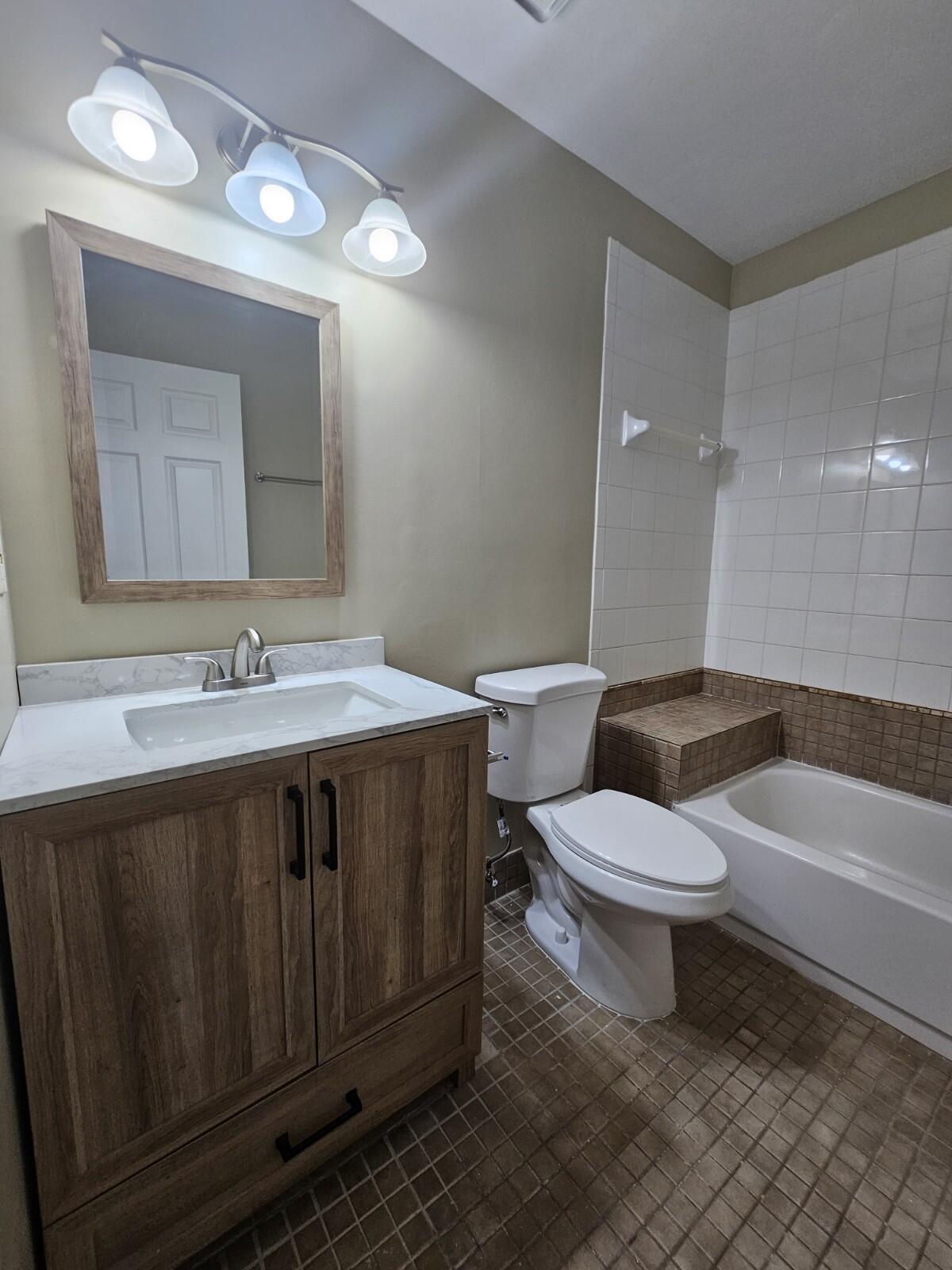 3150 Leewood Terrace, Unit L222 Boca Raton, FL 33431 - Photo 25 of 39 a bathroom with a sink toilet and shower