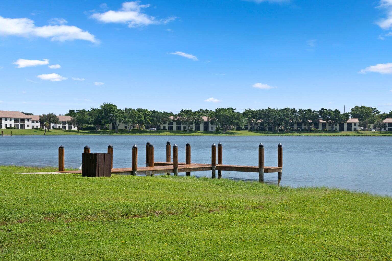 3150 Leewood Terrace, Unit L222 Boca Raton, FL 33431 - Photo 35 of 39 a view of a lake with outdoor space