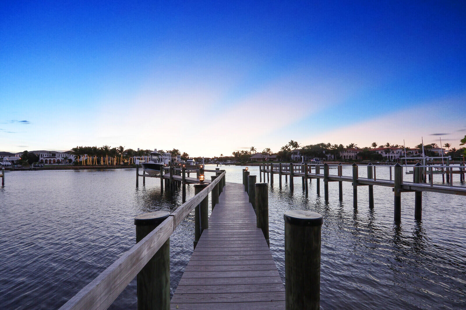 352 River Edge Road Jupiter, FL 33477 - Photo 19 of 50 a view of wooden deck and lake