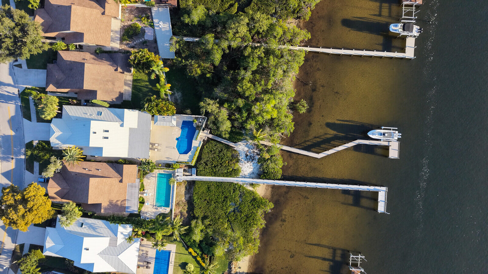 352 River Edge Road Jupiter, FL 33477 - Photo 2 of 50 an aerial view of residential houses with outdoor space