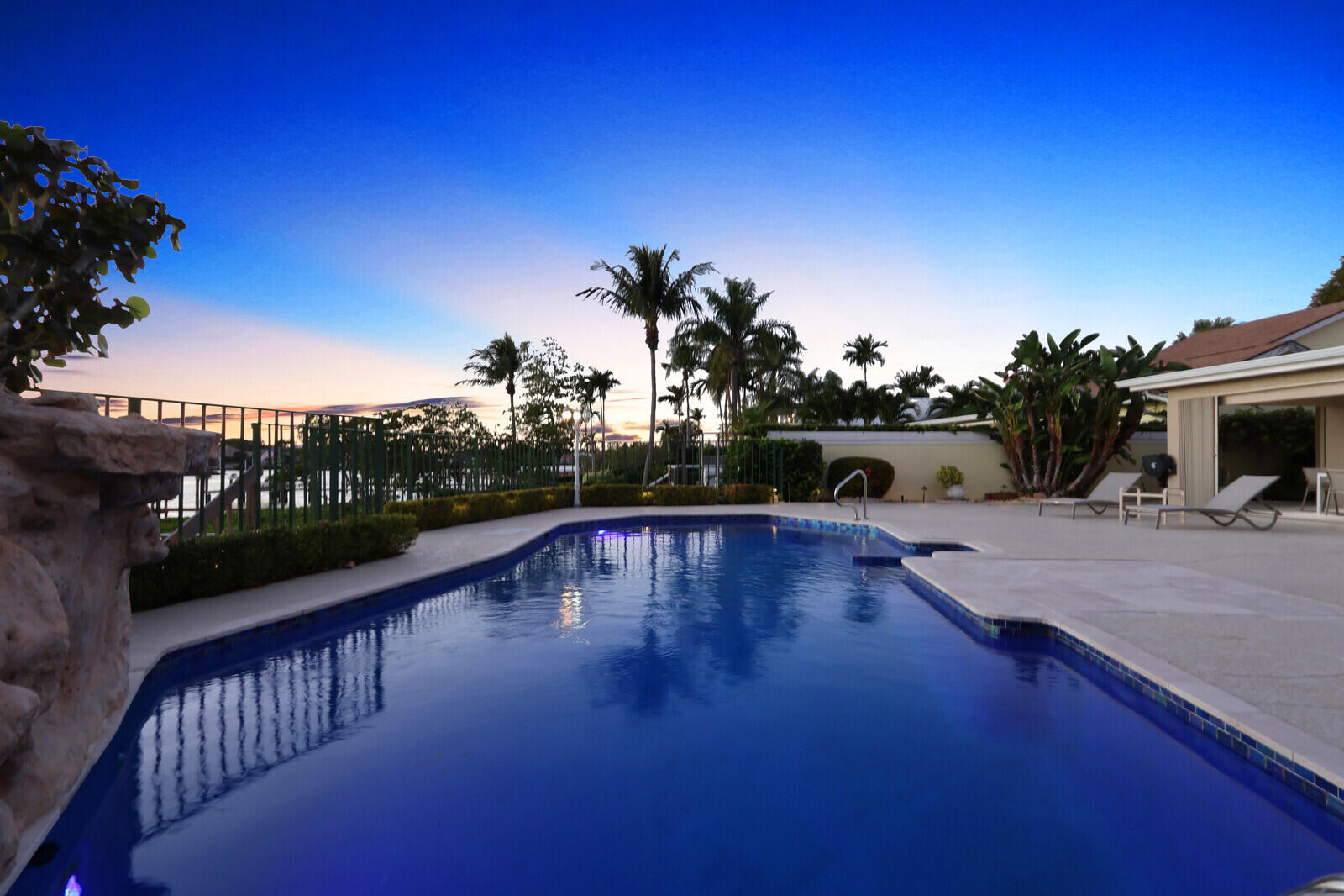 352 River Edge Road Jupiter, FL 33477 - Photo 23 of 50 a view of a swimming pool with a patio
