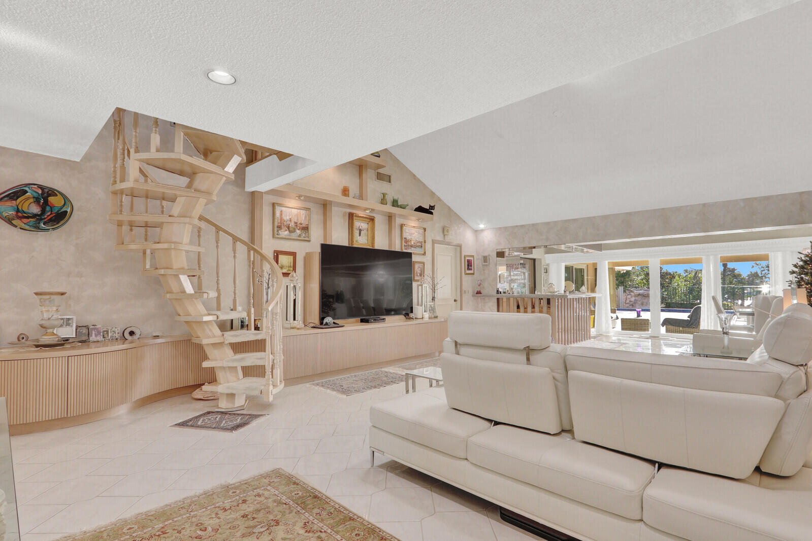 352 River Edge Road Jupiter, FL 33477 - Photo 24 of 50 a living room with furniture a flat screen tv and a large window