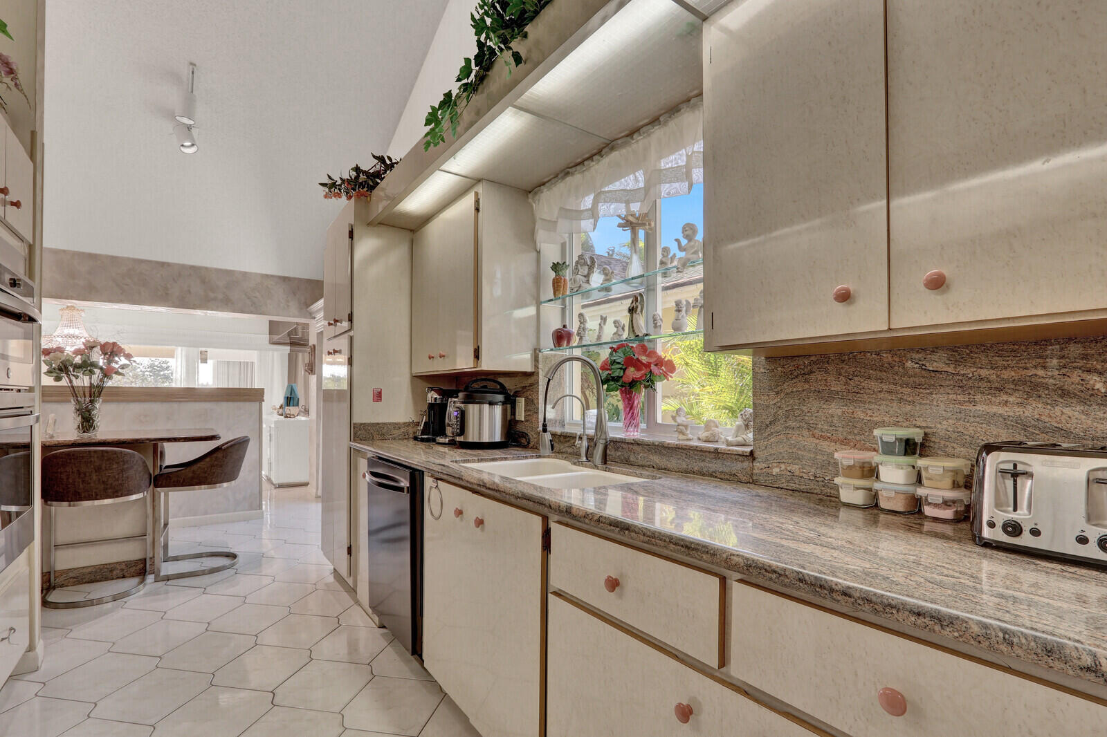 352 River Edge Road Jupiter, FL 33477 - Photo 34 of 50 a kitchen with a sink and cabinets