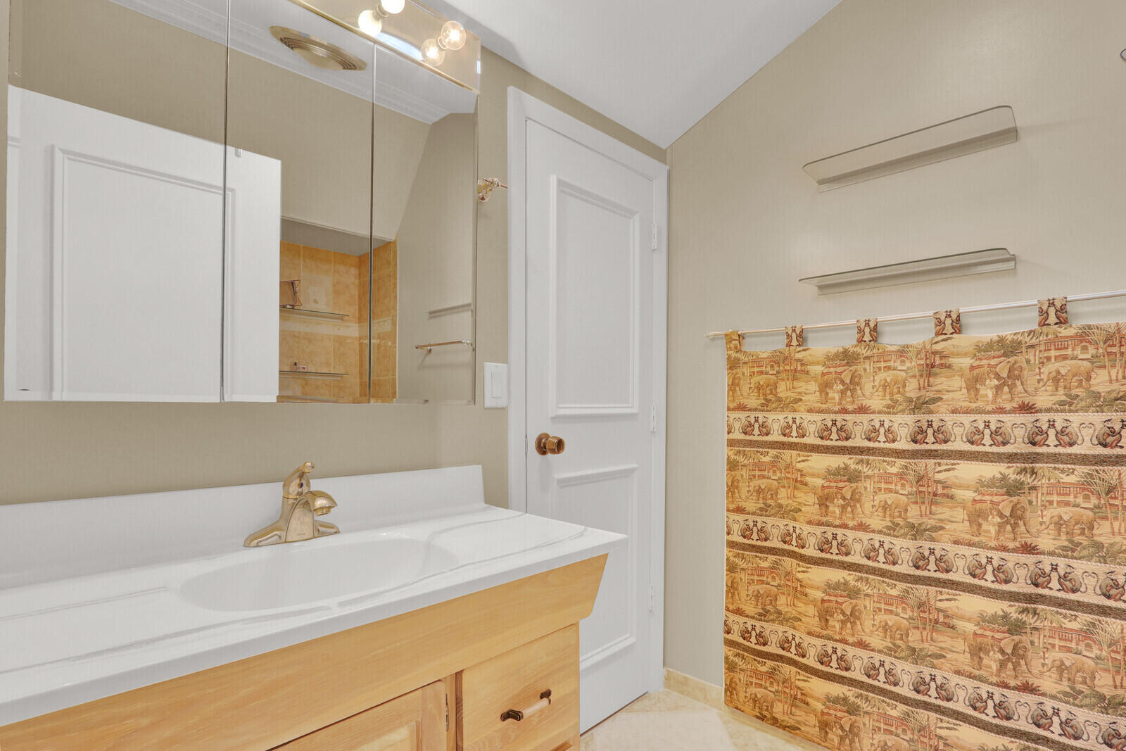 352 River Edge Road Jupiter, FL 33477 - Photo 39 of 50 a bathroom with a sink and a mirror