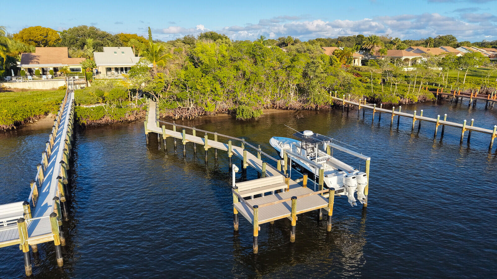 352 River Edge Road Jupiter, FL 33477 - Photo 4 of 50 a view of a balcony with dining table and chairs