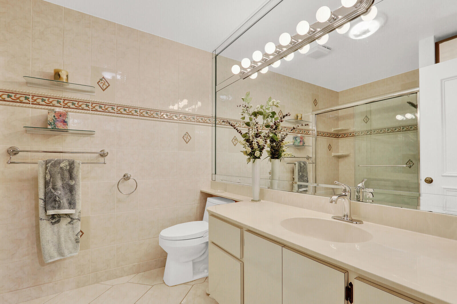 352 River Edge Road Jupiter, FL 33477 - Photo 43 of 50 a bathroom with a sink a toilet and shower
